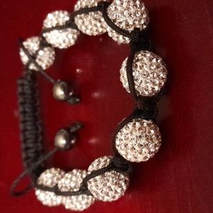 Bracelet with round beads with rhinestones .